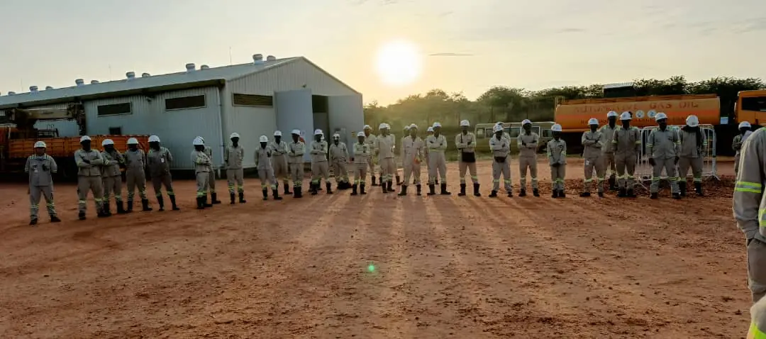 OccuproMed medical team briefing a workforce at sunrise on a remote site